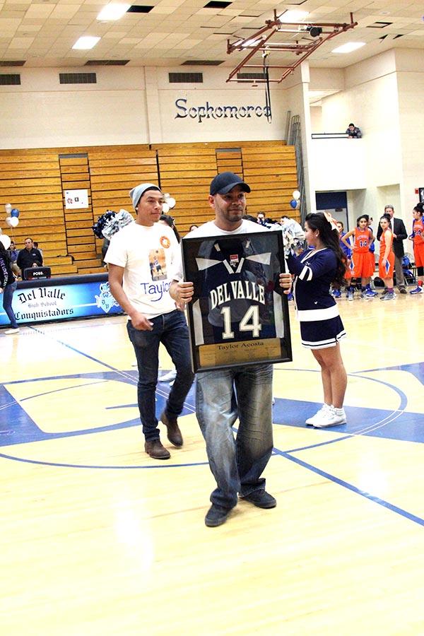 Taylors retired number presented at the girls basketball senior night.