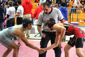 Eric Martinez shakes hands with his opponent 