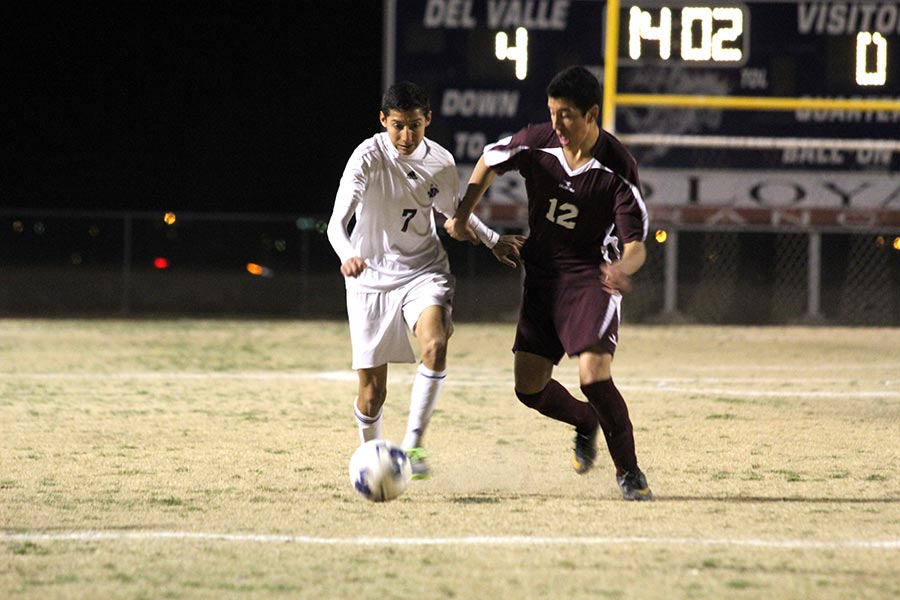 Alfonso pushes off his Ysleta opponent.