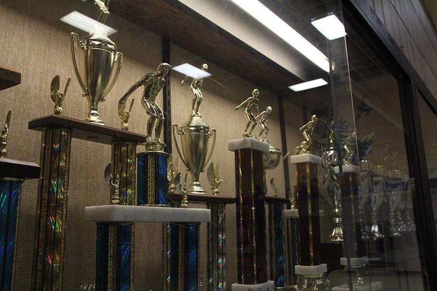 The swim teams Border Invitational trophies range from 1992 to 2012.