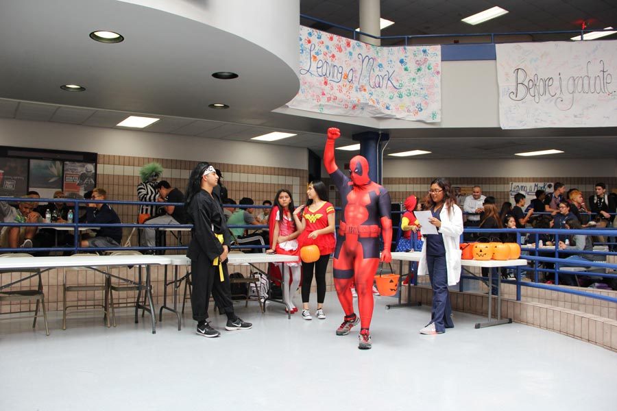 Deadpool wins the superhero contest  and wins a bucket full of candy 