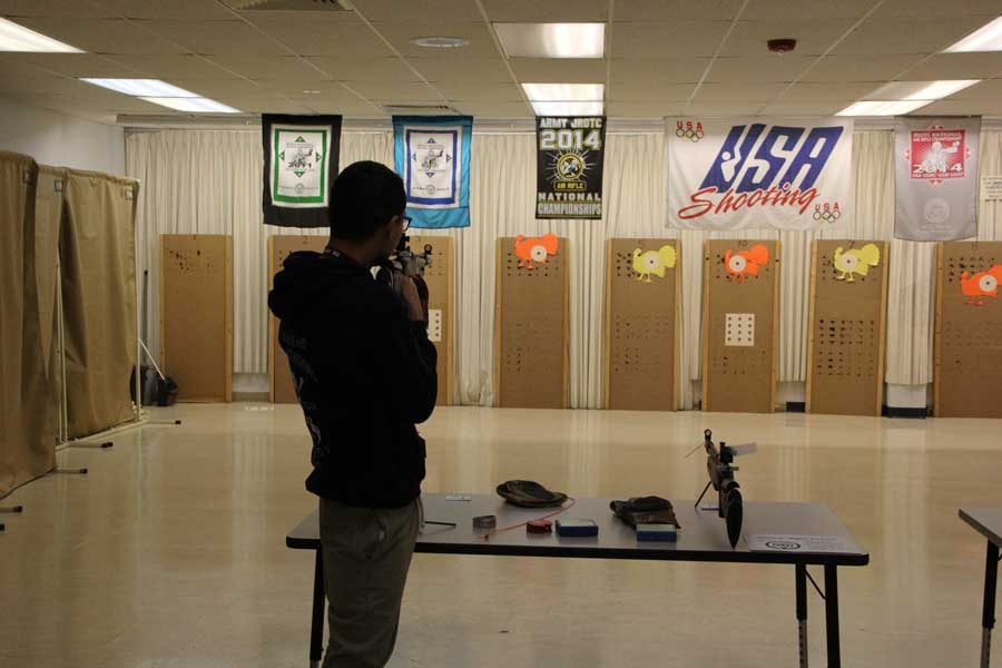 JROTC student shoots for turkey shoot.