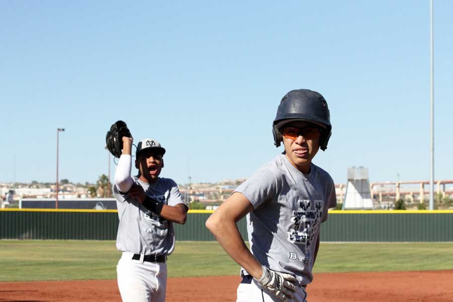 Varsity+players+Jose+and+Antonio+on+the+baseball+field+preparing+for+the+game+April+13%2C+against+Riverside+High+School.