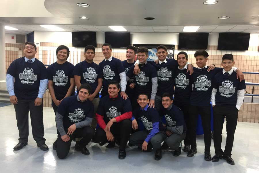 Photo op for Varsity Wrestling team during the year-end banquet. The team was treated to brisket cooked by the coaches.