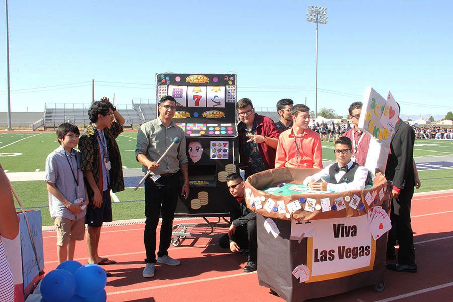Hi Q and the CCC take a picture together with both Homecoming carts at the Pep Rally, Oct 6. 