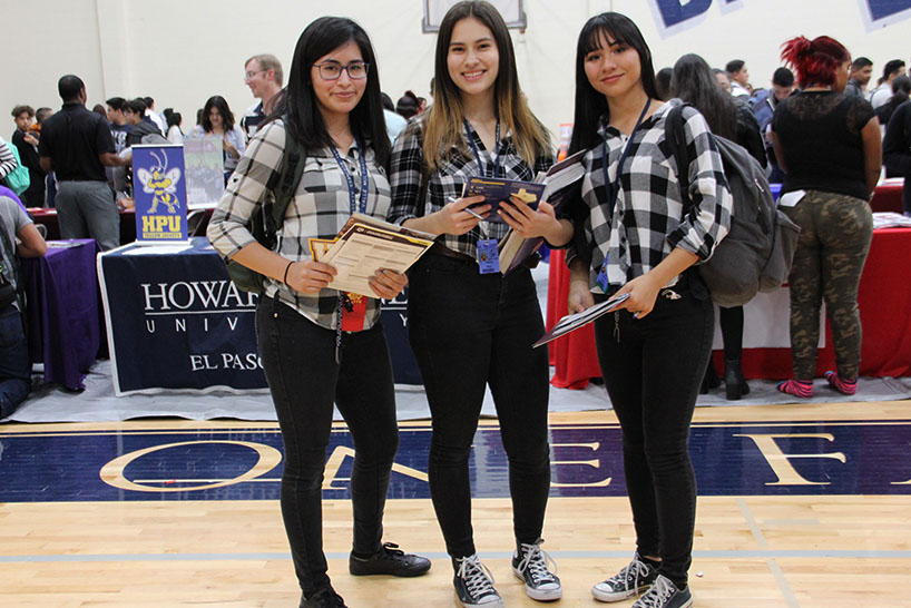 At the College Fair, Andrea, Alana and Nancy  celebrate Red Ribbon Week on Twin Day, Oct. 24,  Say no to drugs in pairs.