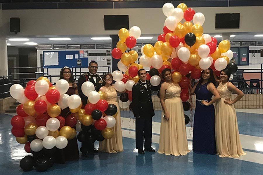 Senior cadets Felicity, Zachary, Julieta, Cristian, Ashley, Frida, and Ashley at their last Military Ball Dec. 9, in the commons. 