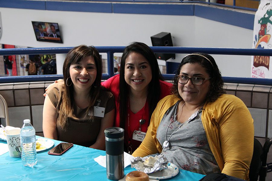 Language arts teachers Andrea Lopez-Morse, Xochitl Lugo, Audrey Gomez meet for breakfast in front of Student Activities.
