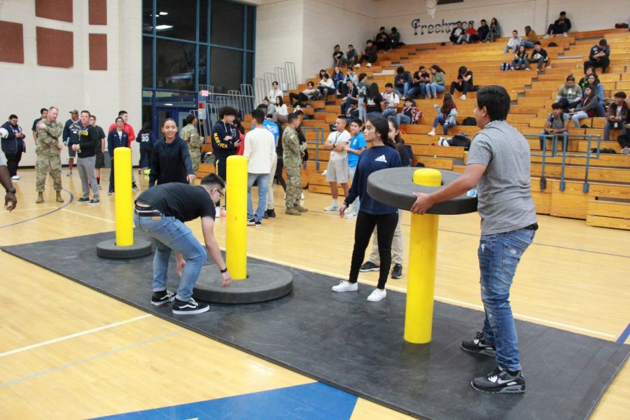 Students compete in the obstacle course built by the U.S. Army to win prizes.