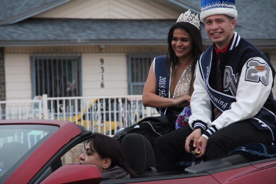 Homecoming+queen+Love+and+king+Roman+wave+to+the+crowd+at+the+homecoming+parade.+