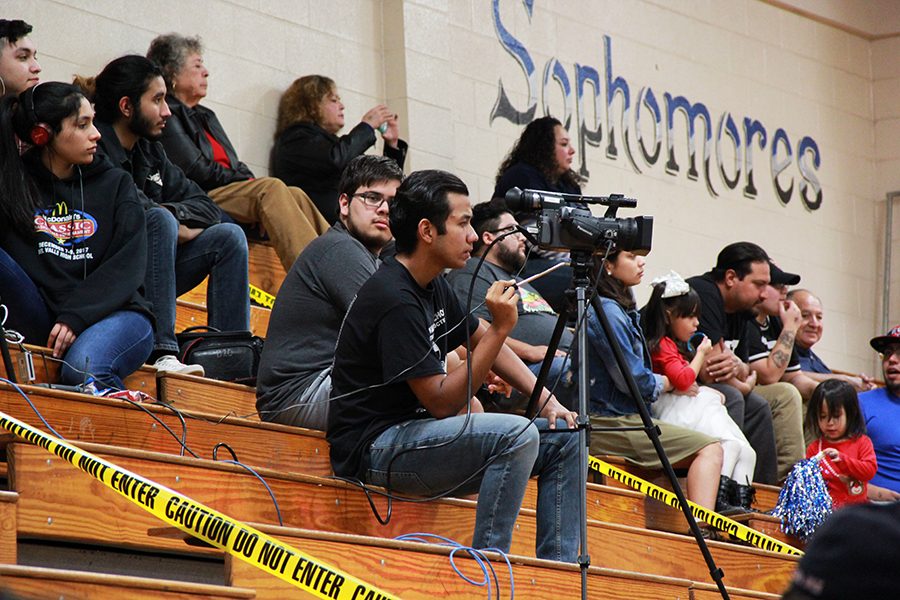 Marco operates the camera during the MacDonalds Classic Basketball Tournament, Dec. 7, for the Conquest Journal livestream.