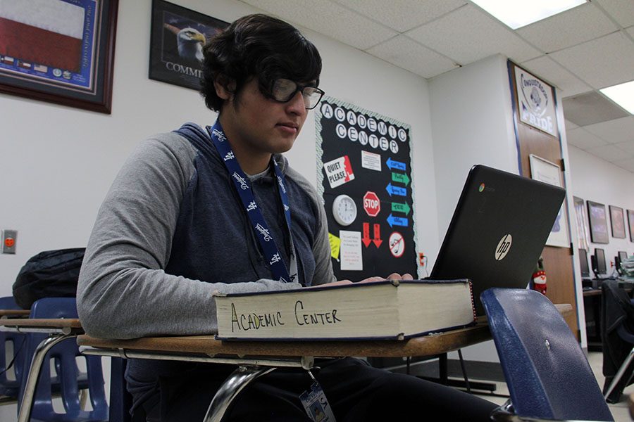 Michael+uses+his+Chromebook+in+the+Academic+Center.