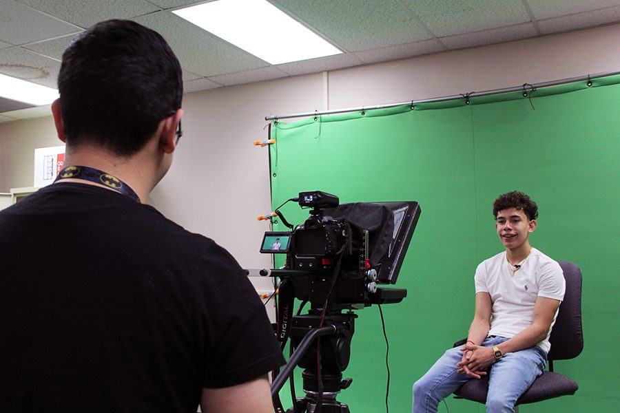 Cameraman Jose Ramos records talent Armando Lara for a KDVH news piece.