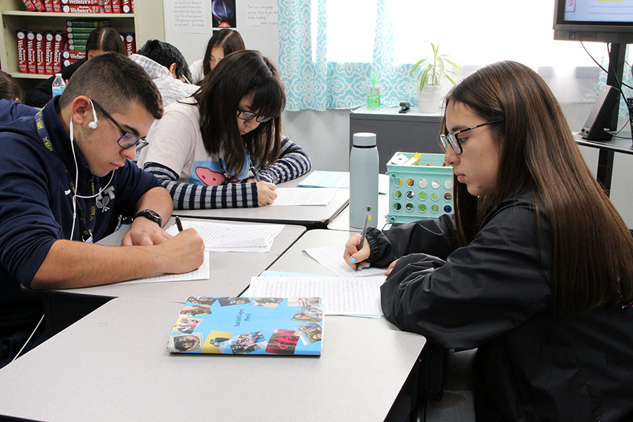 Ap students Dyvanna Soria, Yatziri Lopez and Ramon Uveta work on their Ap III English essays. 