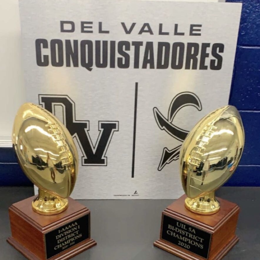 Football team plays against El Dorado High School scoring 44-26 and against Lubbock Monterey 44-43 winning both bi-district and district championship trophies.